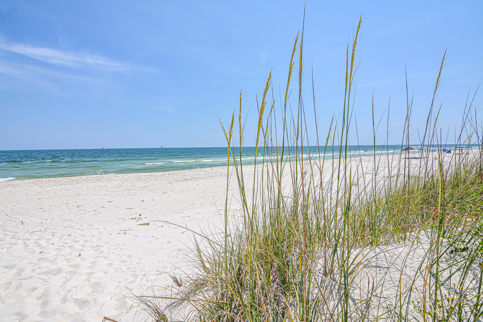 White sand and turquoise Gulf of Mexico water on the beach at Gulf Shores, Alabama